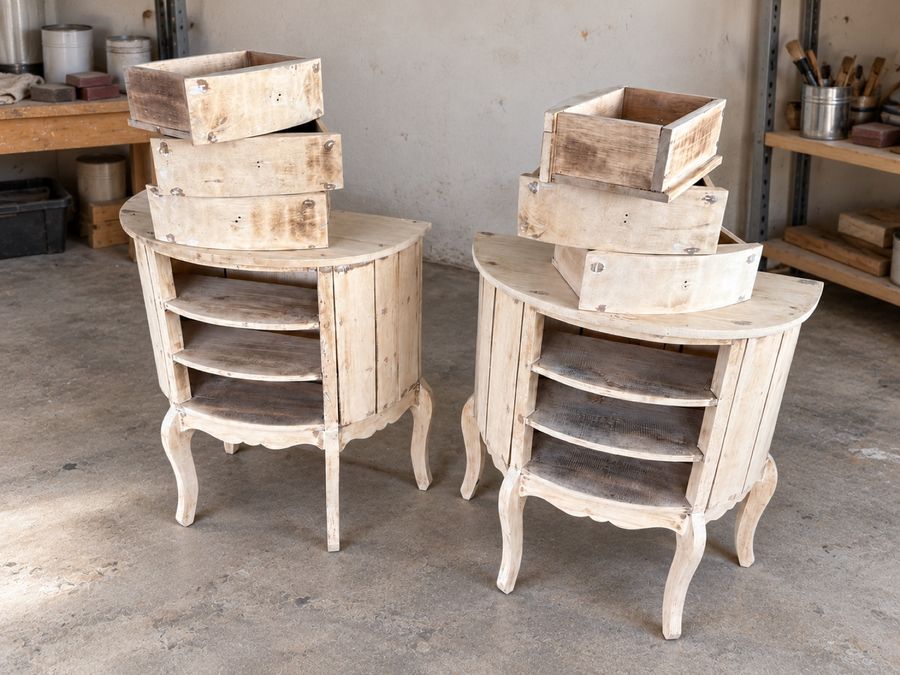 The same chest in the workshop with its drawers out, stripped and sanded